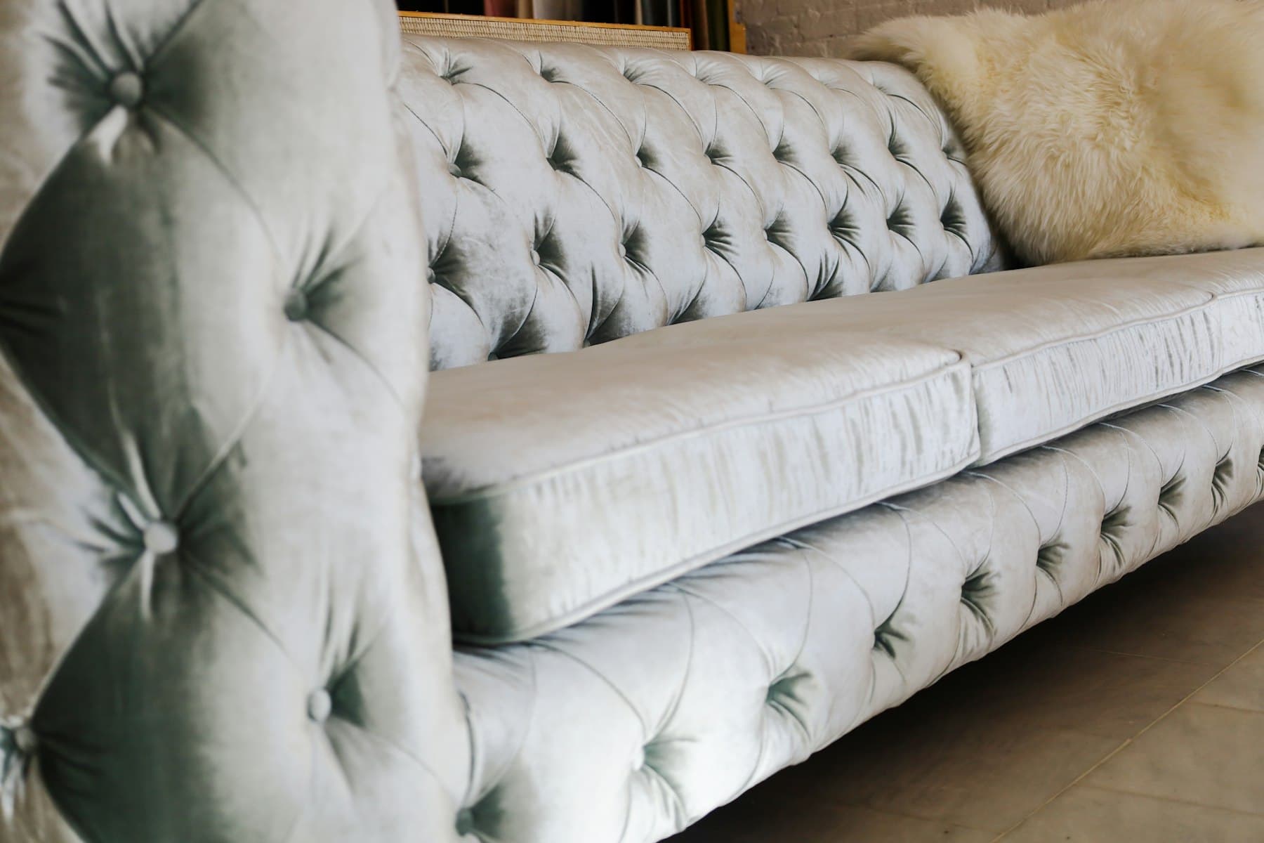 Close-up of a hand-tufted upholstered sofa