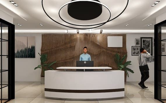 Reception with curved white desk, timber wave wall and circular ceiling light