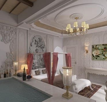 Bedroom suite with carved wall panels and a canopy bed