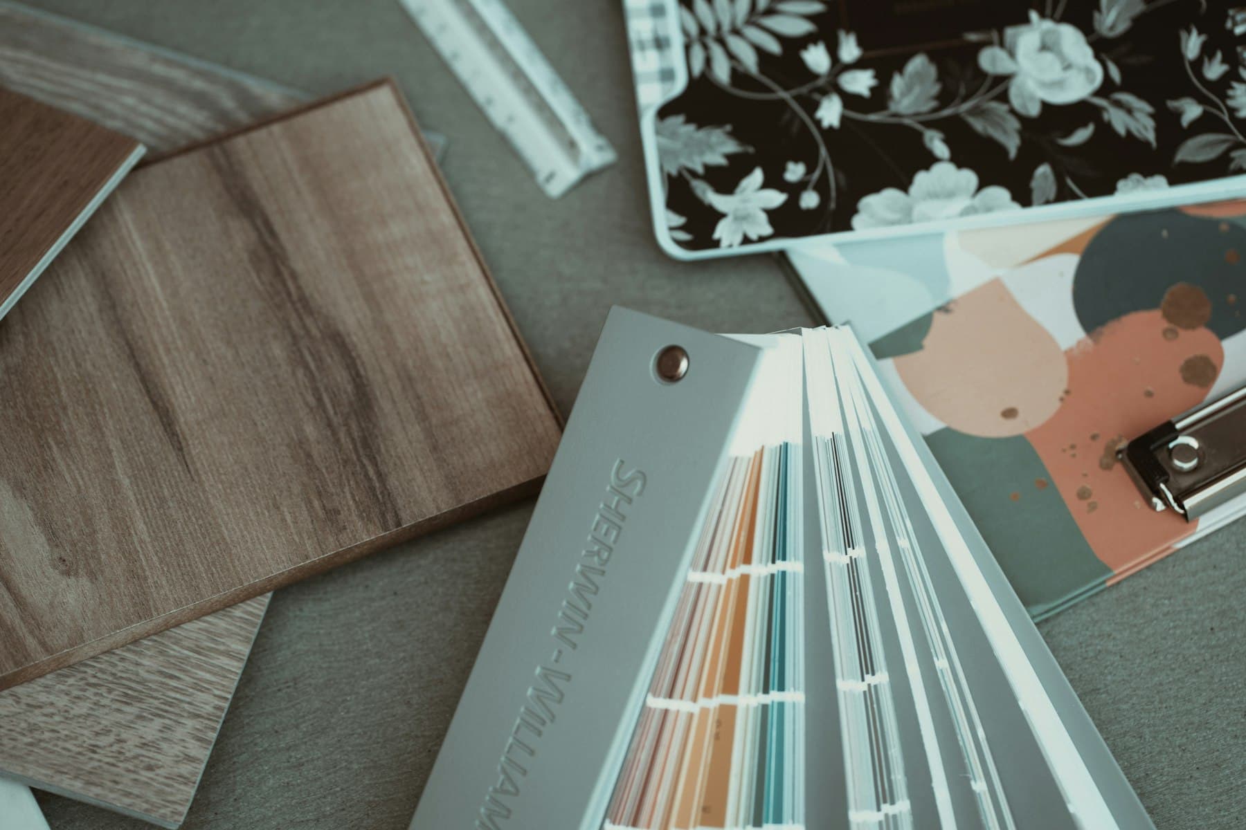 Interior material samples: timber, fabric, wallpaper and colour swatches